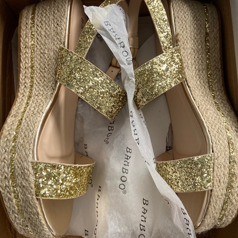 Never worn- gold platform sandals